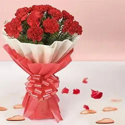 Now deliver this delicate Hand Bunch of Red Carnations in tissue