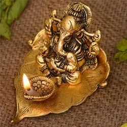 Remarkable Ganesha on Leaf with Diya